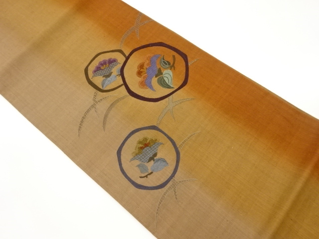 手織り紬相良刺繍丸に花模様洒落袋帯